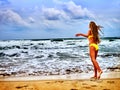 Summer girl sea in yellow swimsuit Royalty Free Stock Photo