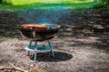 Summer grilling food, sausage, vegetables and kebab meat on barbecue grill over smoke and hot charcoal Royalty Free Stock Photo