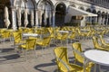 summer ground in St. Marks Square: an empty yellow seats in summer area restaurant