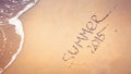 Summer 2015 handwriting on the sand. Royalty Free Stock Photo