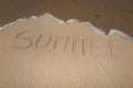 summer handwritten on sand, summer background, sea and sand background