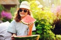 Summer happy child girl eating watermelon outdoor Royalty Free Stock Photo