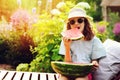 Summer happy child girl eating watermelon outdoor on vacation Royalty Free Stock Photo