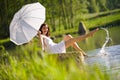 Summer - Happy romantic woman sitting by lake