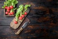 Summer harvested red radish. Growing organic vegetables. Large bunch of raw fresh juicy garden radish , on old dark  wooden table Royalty Free Stock Photo