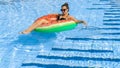 Summer hat pool. Young sexy woman with green inflatable ring in bikini swimsuit, sunglasses floating in blue water Royalty Free Stock Photo