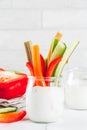 Summer healthy snack appetizer, assorted colorful fresh vegetable sticks (celery, rhubarb, pepper, cucumber and carrot) with Royalty Free Stock Photo