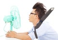 Summer heat, business man use fans to cool down Royalty Free Stock Photo