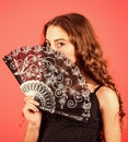 Summer heat. Fresh air. Kid girl fanning herself with fan. Air circulation. Mysterious vintage girl. Cooling and Royalty Free Stock Photo