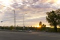 summer, heat, travel, weather, cityscape - background wide paved roadway road with city cars in spring hot evening at Royalty Free Stock Photo