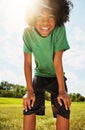 Summer, here I come. Portrait of a happy boy standing outside on a bright summers day. Royalty Free Stock Photo