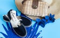 Summer accessories, shoes and hat with bag on blue background Royalty Free Stock Photo