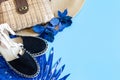 Summer accessories, shoes and hat with bag on blue background Royalty Free Stock Photo
