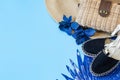 Summer accessories, shoes and hat with bag on blue background Royalty Free Stock Photo