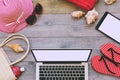 Summer holiday background with laptop and beach items. View from above