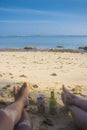 summer holiday beach beer with feet on beach