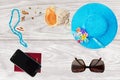 Summer holiday concept, accessories and travel items over wooden background Royalty Free Stock Photo