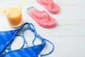 Summer holiday concept, Beach items with smoothie, bikini and fl Royalty Free Stock Photo