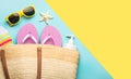 Summer holiday concept.Top view of beach bag with flip flops,beach towel,sunglasses,sunscreen and starfish with space for text Royalty Free Stock Photo