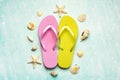 Summer holiday concept.Top view of colored beach flip flops with sea shells and starfish Royalty Free Stock Photo