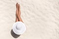 Summer holiday fashion concept - tanning woman wearing sun hat a