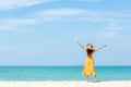 Summer Holiday. Lifestyle woman chill holding big white hat and wearing yellow dress fashion summer trips standing chill on the sa