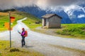 Mountain hiking trails and hiker woman with map, Switzerland, Europe