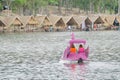 Two girls play a bike boat