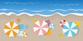 Summer holiday on a tourist beach top view with parasol flip flops ball and lifebelt