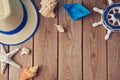 Summer holiday travel background with seashells and paper boat. View from above. Flat lay