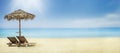 Summer holiday travel background. Sun umbrella and chairs on sandy beach Royalty Free Stock Photo