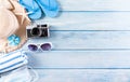 Summer holiday, travel and vacation concept. Sunglasses, starfish, beach hat, seashell and medical mask to protect covid-19 on Royalty Free Stock Photo
