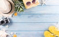 Summer holiday, travel and vacation concept. Sunglasses, starfish, beach hat, seashell on pastel blue wooden background Royalty Free Stock Photo