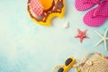 Summer holiday vacation background with orange juice and beach accessories. Top view from above Royalty Free Stock Photo