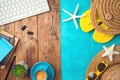 Summer holiday vacation concept with beach accessories and office desk background. Top view from above Royalty Free Stock Photo