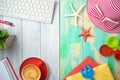Summer holiday vacation concept with beach accessories and office desk background. Top view from above Royalty Free Stock Photo