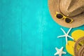 Summer holiday vacation concept with beach accessories over blue wooden background. Top view from above Royalty Free Stock Photo