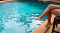 Young asian Beautiful woman relaxing in swimming pool at spa resort. Beautiful tropical beach front hotel resort with swimming Royalty Free Stock Photo