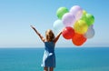 summer holidays, celebration, family, children and people concept - happy girl with colorful balloons