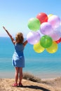 summer holidays, celebration, family, children and people concept - happy girl with colorful balloons Royalty Free Stock Photo