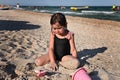 Summer vacation. Adorable toddler girl playing with beach toys on the sandy beach. Summer holidays concept. Active lifestyles and Royalty Free Stock Photo