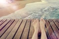 Summer holidays concept background with legs over wooden pier Royalty Free Stock Photo