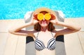 Summer holidays concept - sunny woman holds in hands oranges Royalty Free Stock Photo