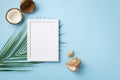 Summer holidays concept. Top view photo of white photo frame coconut shells and palm leaves on isolated pastel blue background Royalty Free Stock Photo