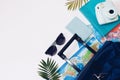 Summer holidays concept. Travel, tourism and vacation concept background. Traveler accessories. Flat lay. Blue suitcase with trav