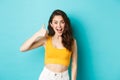 Summer holidays and emotions concept. Cheerful young woman saying yes, praising good choice, nice work, showing thumbs Royalty Free Stock Photo