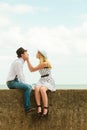 Loving couple retro style dating on sea coast Royalty Free Stock Photo