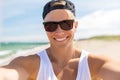 Man in sunglasses taking selfie on summer beach Royalty Free Stock Photo