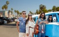 Hippie friends over minivan car at venice beach Royalty Free Stock Photo