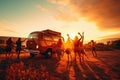 Summer holidays, road trip, vacation, travel and people hippie friends dancing in the light of sunset over minivan car